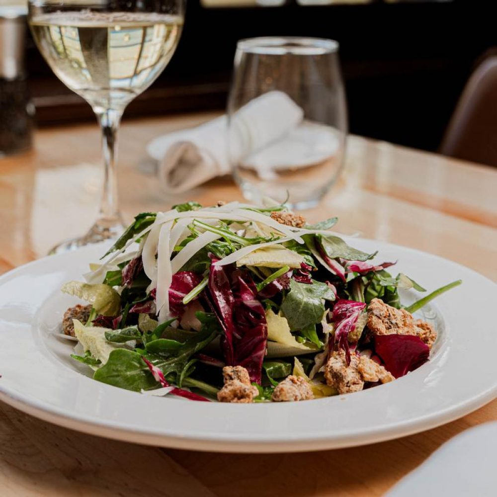  Insalata Tricolore:  Endive, pear, gorgonzola, caramelized walnuts & honey dressing.